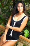Model wearing Luxury Crinkle Tank Top and Shorts in black with delicate trim for casual elegance
